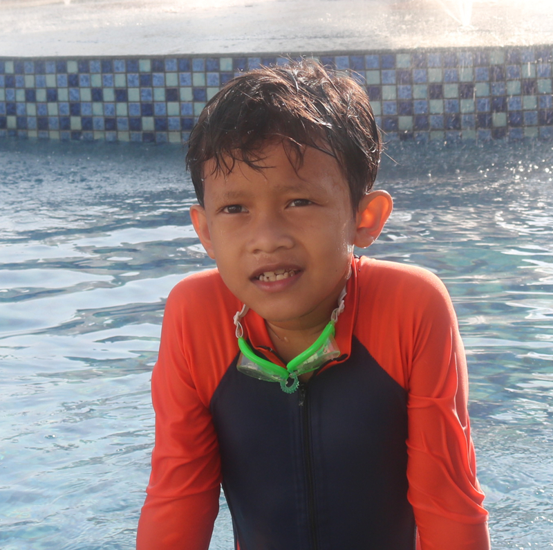 Syamil in a swimming shirt
