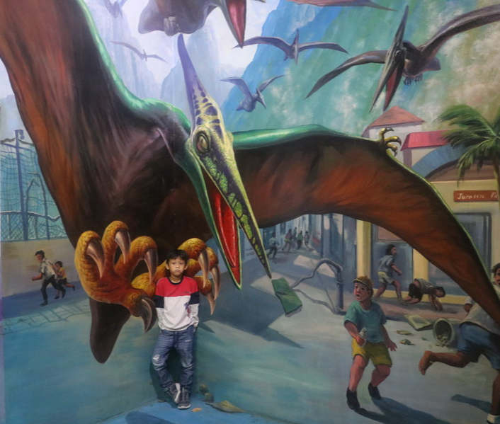 Syamil with a flying dino